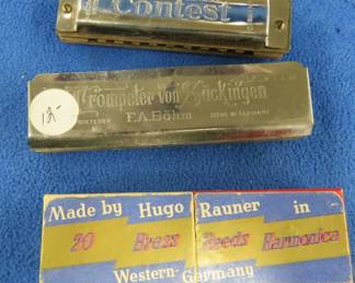 Lot 357. Hugo Rauner 20 Brass Reed 10-hole diatonic harmonica and box. Low draw notes don't work. F.A. Bohm Trompeter von Sackingen 20-hole harmonica with bad draw notes. Rauner Seydel Bohm Contest 10-hole diatonic harmonica in the key of C.