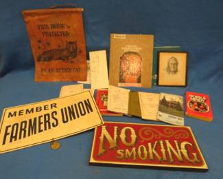Lot 114. Metal Farmers Union sign, old maps, leather attack cat sign, and more