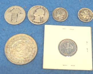 Lot 196. Silver coins:.1935P Washington quarter. Standing Liberty quarter with no date. Two Mercury dimes. One Roosevelt dime. One 5 peso coin from Mexico. 72% silver. Actual silver weight .4179 troy ounce