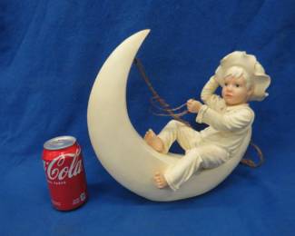 Lot 471. Little Boy Riding the Moon decorative piece. Can either hang or sit flat.