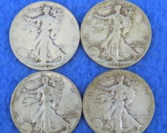 Lot 35. Four Walking Liberty half dollars. 1927 S, 1941 D, 1943 D, and a 1944 P.