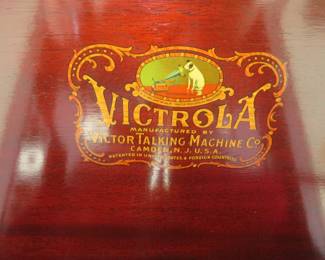 Lot 149. Victor Victrola wind-up record player and cabinet with records. Works. Approx. 23 x 45 x 23 inches