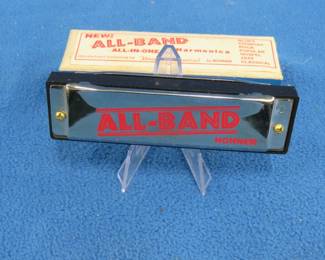 Lot 412. Hohner All-Band 10-hole harmonica in the key of C in the box with papers in like-new condition. Sounds great.