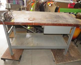 Lot 150. Heavy duty shop table on a steel frame with an attached extension cord outlet and a Dura Craft #5 vise.
