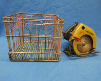 Lot 465. Skilsaw 7 1/4" circular saw and a vintage milk crate