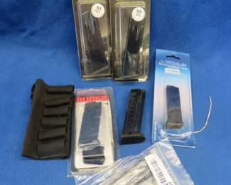 Lot 257. Two Canik TP9 18-round 9mm. One Ruger SR9C 10-round 9mm. One Ruger SR9 17-round 9mm. One Walther PPK 6-round .380 ACP. One Walther PPK 10-round .380 ACP. One shotshell sleeve.