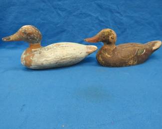 Lot 50. Two wooden duck decoys. One with glass eyes and one with tack eyes. Both have repaired necks.