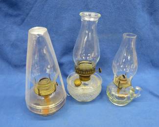 Lot 43. Three oil lamps