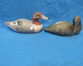 Lot 95. Two decorative ducks. The painted duck is wooden and the other is brass