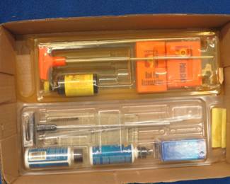 Lot 462. Two partial gun cleaning kits