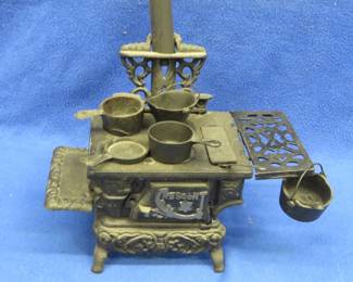 Lot 450. Miniature Crescent cast iron cook stove