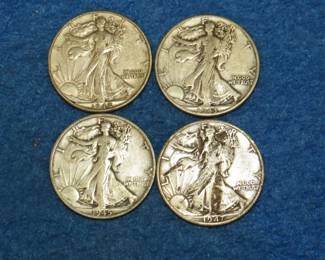 Lot 39. Four Walking Liberty half dollars. 1942 D, 1943 P, 1945 S, and a 1947 D.