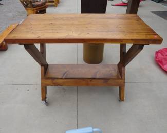 Lot 145. Rolling table in excellent condition 49.5 x 38 x 25.5 inches