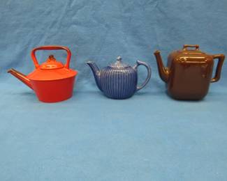 Lot 394. Three vintage teapots: Metlox Red Rooster Poppytrail. Fraunfelter ribbed cobalt blue. Santa Anita Ware. All in very good condition.