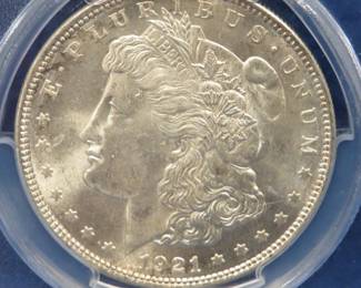 Lot 102. 1921 P Morgan silver dollar slabbed and graded (MS63) by PCGS