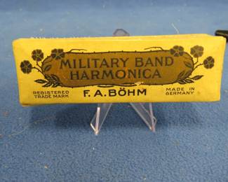 Lot 353. F.A. Bohm 10-hole Military Band diatonic harmonica in the key of A with the box. Harmonica and box are in VGC. Sounds great.