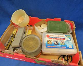 Lot 318. Plunger can, first aid items, hand tools, and more