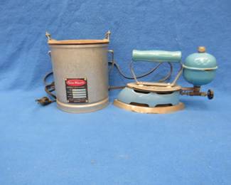 Lot 473. Coleman gas-fired iron and a Sta-Warm heated pot