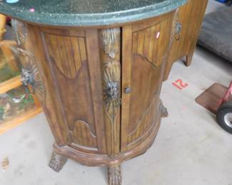 Lot 164. Credenza with a faux stone top, lion embellishments and claw feet 33 x 41 x 20 inches. Excellent condition