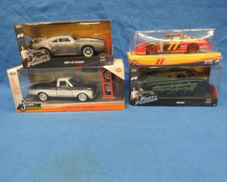 Lot 40. Four die-cast vehicles