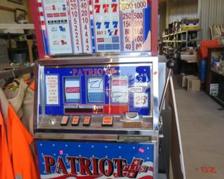 Lot 156. Patriot Plus slot machine in working condition. Includes keys and tokens. Bring help to load. Shipping not available on this item.