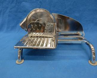 Lot 457. Rival food slicer and a Rubbermaid Roughneck tote