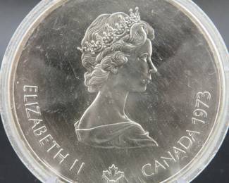 Lot 483. 1973 silver $10 Canadian Montreal Olympics coin that weighs 54.66 grams in the case