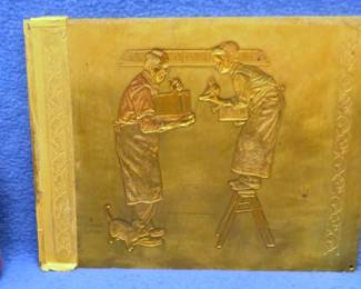 Lot 173. Norman Rockwell brass embossing plate "A Helping Hand- Year End Count". 9 7/8 x 7 1/2 x 1/4 inches. 5 lbs.
