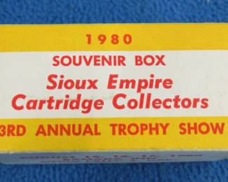 Lot 338. 1980 souvenir box from the Sioux Empire Cartridges Collectors show. 50 rounds of 22 LR. Box is in very good condition.