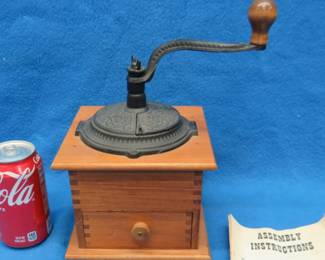 Lot 409. Coffee mill. Appears unused.