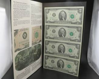 Lot 484. A sheet of four 1976 uncut $2 bills in a folder that describes the components of the $2 bill