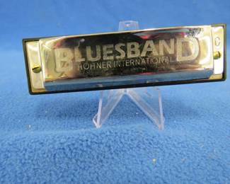 Lot 283. Hohner International Blues Band diatonic 10-hole harmonica ion the key of C with the box and papers. All are in excellent condition.