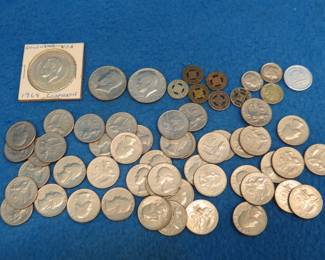 Lot 194. Two Bicentennial halves, 47 Bicentennial quarters, six transportation tokens, a 1964 Barry Goldwater coin and more