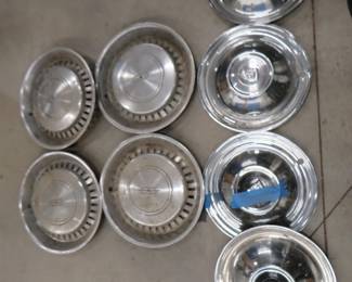 Lot 115. Two sets of 4 each hubcaps