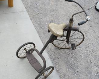 Lot 122. Very old tricycle with 19-inch front wheel and a Mickey Mouse bell