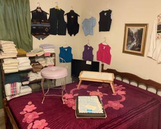 Vest, tops, nice towels, tray table, vanity stool in purple, small tv, tv stand, full sized bed