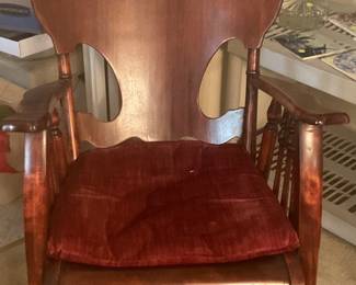 Antique shield back rocker with red velvet chair pad