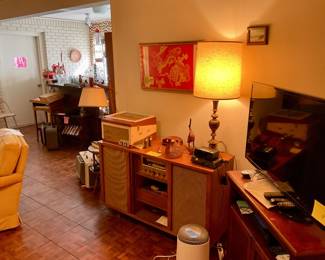 Stereo console cabinet, cabinet in excellent condition, radio works some, turntable needs repair 