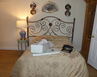 King size metal headboard, full size mattress & boxpring, pedestal/side table, table lamp, decorative wall hanging & collectible plates