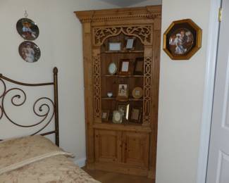 Rustic pine corner curio cabinet with ornate fretwork
