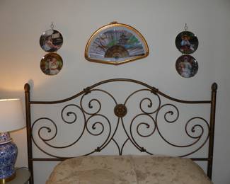 King size metal headboard, full size mattress & boxpring, pedestal/side table, table lamp, decorative wall hanging & collectible plates