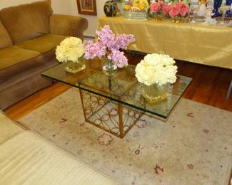 Glass top brass base coffee table