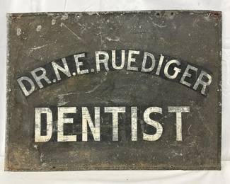 Early Dr. N.E. Ruediger Dentist Tin Sign, 22in x 17in