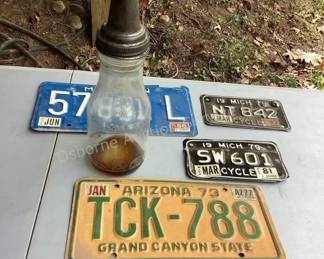 Vintage license plates & oil bottle