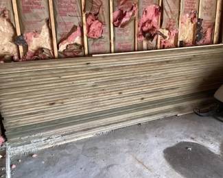 Stack of pressure treated tongue & groove style boards