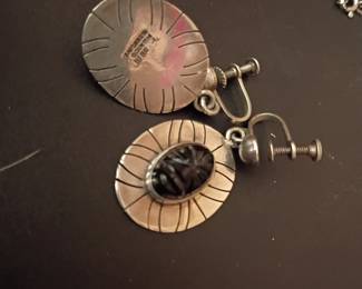 Vintage screw-back earrings featuring carved black floral-style cabochons Sterling