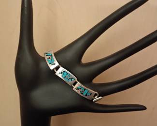 vintage Southwestern style sterling silver bracelet with turquoise inlay accents. Marked 925 sterling