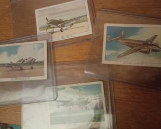 Collection of vintage aviation trading cards featuring classic military aircraft