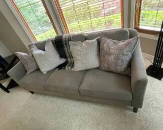 Modern Flannel Gray Couch With Pillows and Throw