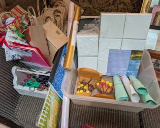 handmade small shelves, mini canvases, brown bags with handles, holiday bags and paper, scissors of varying sizes